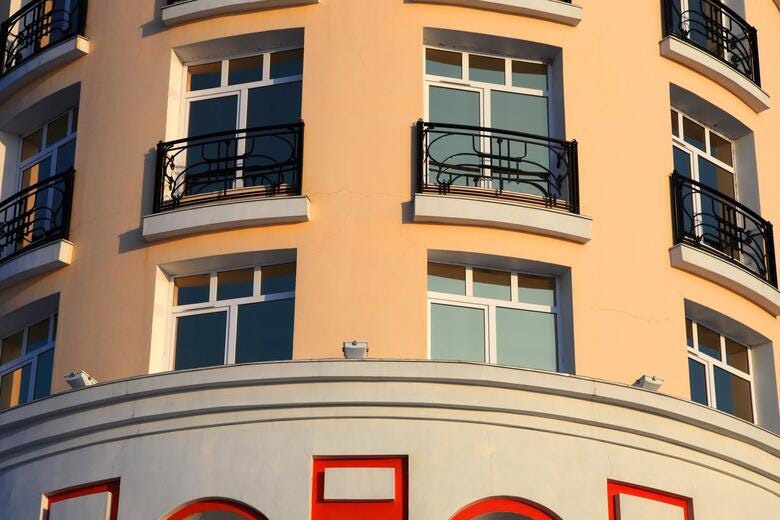 a building with windows and balconies